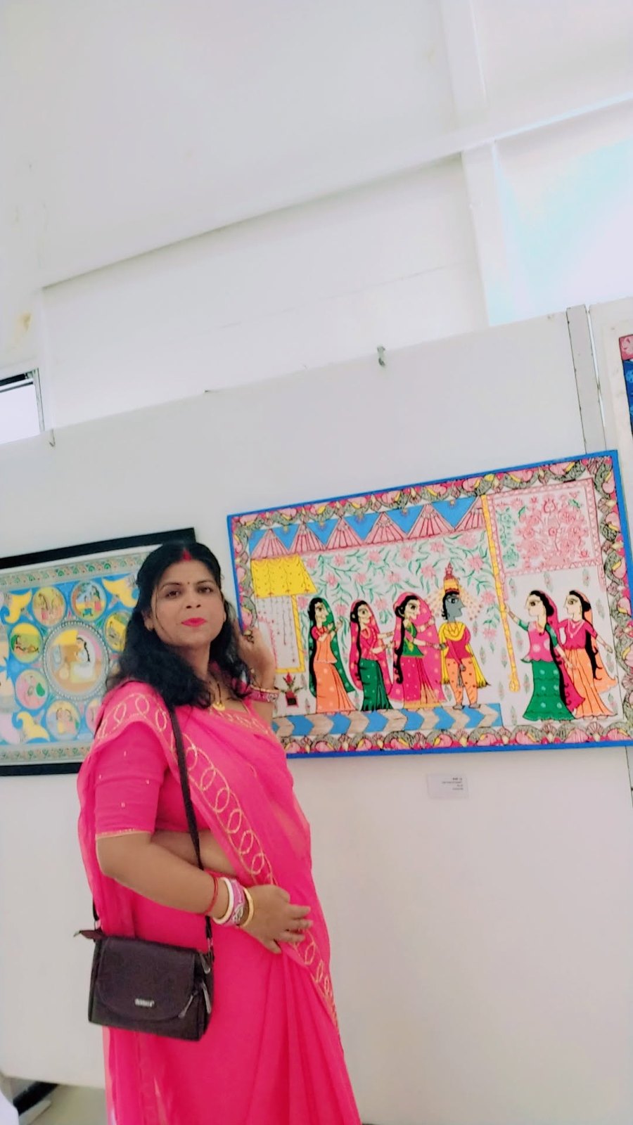 Chanda Kumari Karn with her artwork at an exhibition