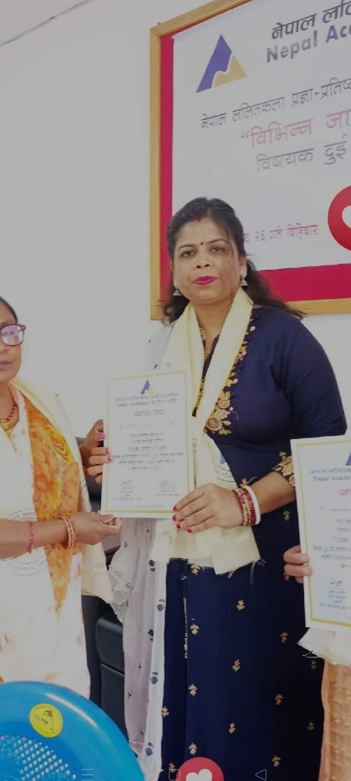 Chanda Kumari Karn receiving an art recognition certificate